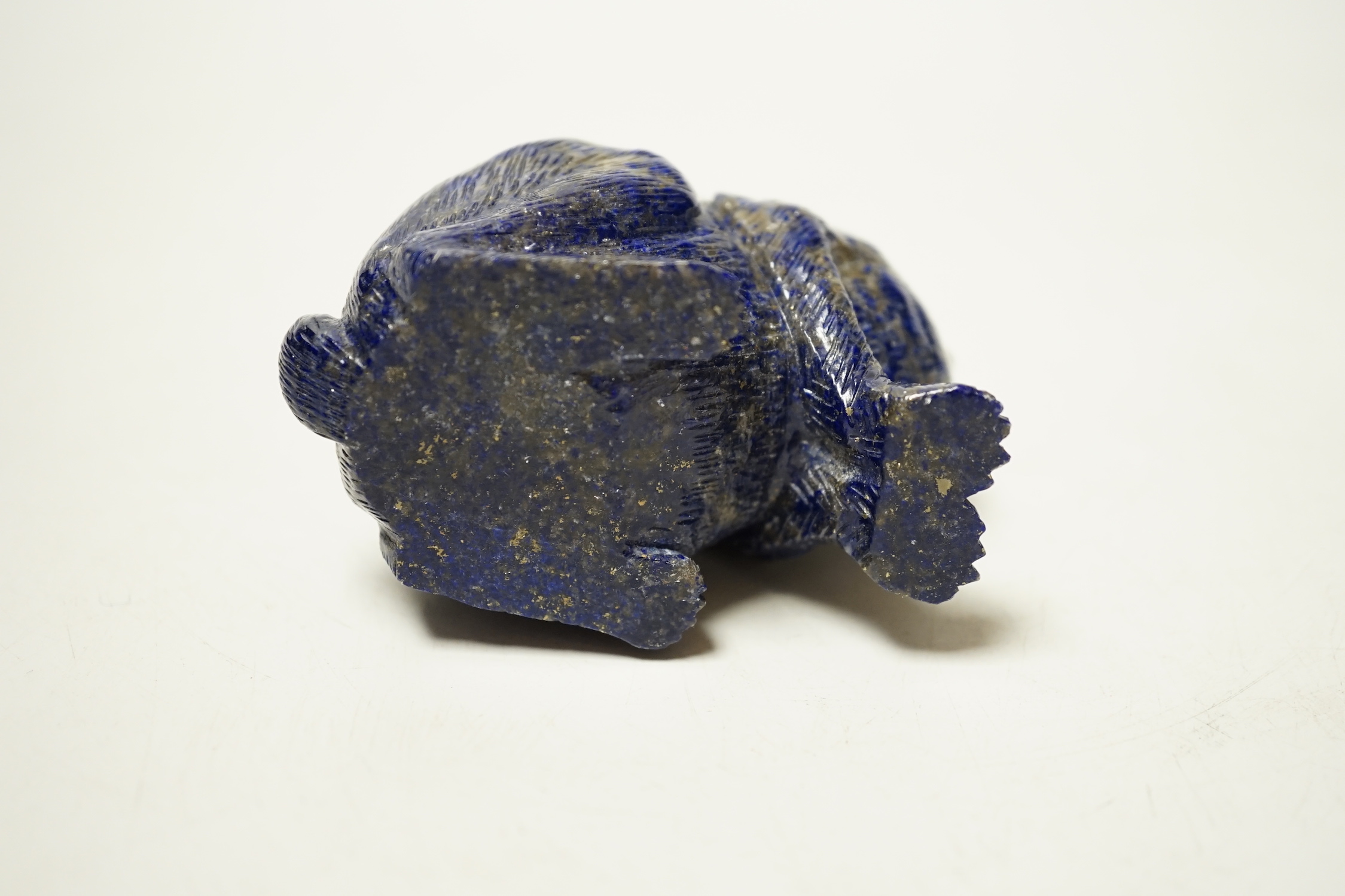 A Chinese lapis lazuli model of a hare, with glass inset eyes, 8.4cm high